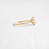 Oval stone ring with polished pave detailing