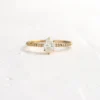 Refined ring design with shimmering side stones
