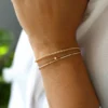 Clean polished bracelet with pave-set stones along the bar
