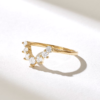 Curved ring designed to contour around an engagement ring
