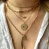 Gold-plated silver talisman with evil eye motif and gemstones