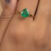 Sterling silver ring with pear-shaped green bezel-set stone