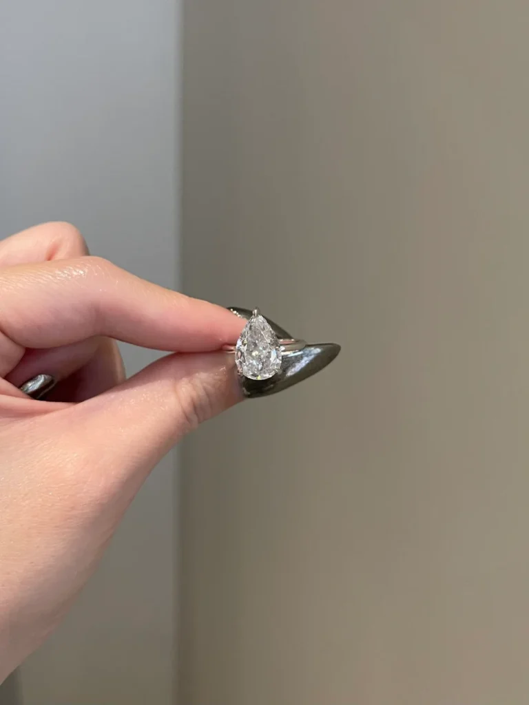 925 Sterling Silver Pear Shaped 3-Prong Hidden Halo Pave Bridge Solitaire Ring