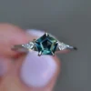 Pentagon-shaped sapphire-inspired stone in a solitaire ring setting
