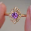 Sterling silver ring with a pink sapphire and sparkling accents