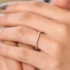 Prong-set diamond eternity ring with sparkling stone row