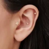 Gold-plated silver stud piercing with a prong-set CZ stone