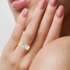 Sterling silver engagement ring with pave-set round stones and bright centre stone