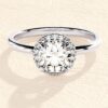 Round cut ring with prong setting and halo stones