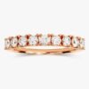 Anniversary ring with balanced nine-stone basket setting