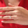 Simple promise ring with a refined round cut centre stone
