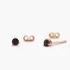 Sterling silver ruby stud earrings with a classic round cut design