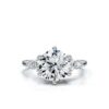 Engagement ring featuring round and kite side stones