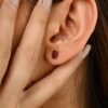 Stud earrings featuring two ruby CZ gemstones in 925 sterling silver