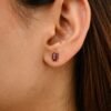 Compact stud earrings measuring 6.5 mm long and 4.7 mm wide