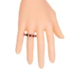 Eternity band ring with continuous ruby-inspired stones