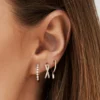 925 Sterling Silver hoop earrings with shared prong-set CZ stones