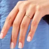 Faith ring featuring a sideways cross and subtle sparkle