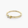 Minimalist ring with a prong-set baguette-cut centre stone