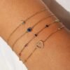 Polished sterling silver bracelet with thick gold plating and blue stone