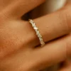 Ring with 8 marquise stones and 9 round stones