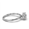 Elegant engagement ring with round stones along the band