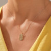 Gold-plated sterling silver necklace with a slim octagonal pendant