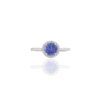 Ring featuring a round faceted-cut tanzanite and pave-set CZ diamonds