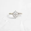 Sterling silver ring with halo setting and oval cut stone