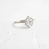 Gold-plated ring featuring a halo-set oval CZ diamond