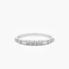 Diamond ring with balanced round and baguette-shaped stone arrangement