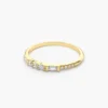 Delicate 1.25 mm band on a three-stone sterling silver ring