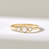 Three-stone ring featuring premium CZ diamonds and bezel settings