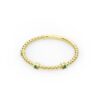 Elegant ring with a clean three-stone silhouette and emerald stones