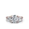 Classic three stone ring with a round centre stone and pear accents