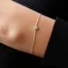 Gold-plated sterling silver station bracelet with alternating diamond-style stones