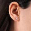 Dainty gold-plated stud earrings with a refined minimal design