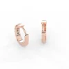 Delicate sterling silver hoop earrings with refined emerald colour
