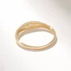 Polished tiny star signet ring with subtle sparkling detail