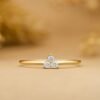Delicate gold-plated ring with three side-by-side cluster settings
