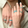 Turquoise band ring with bezel-set round stones