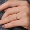 Gold-plated anniversary ring with round stones in mixed sizes