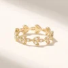 Eternity ring with graceful vine-like curves and polished finish