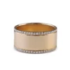 Bold cigar band ring with delicate diamond edging along the sides