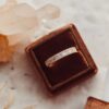 Alternating horizontal baguette and round stone ring with a distinctive design
