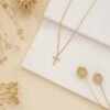 Beaded cross necklace with small cross pendant and bead details