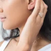 Gold-plated huggie earrings with baguette and pave-set CZ stones