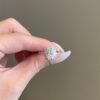 Cluster oval engagement ring with oval centre stone and pave accents