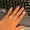 Cluster oval engagement ring with elegant oval silhouette and added dimension