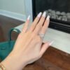 Cluster oval engagement ring with polished pave setting and refined shape